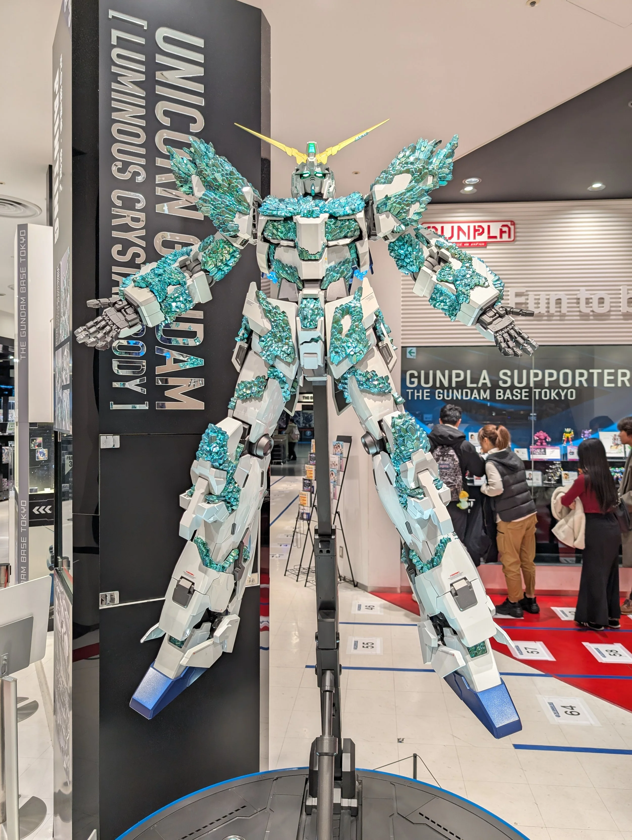 Shelves of Gunpla kits inside Gundam Front Tokyo.