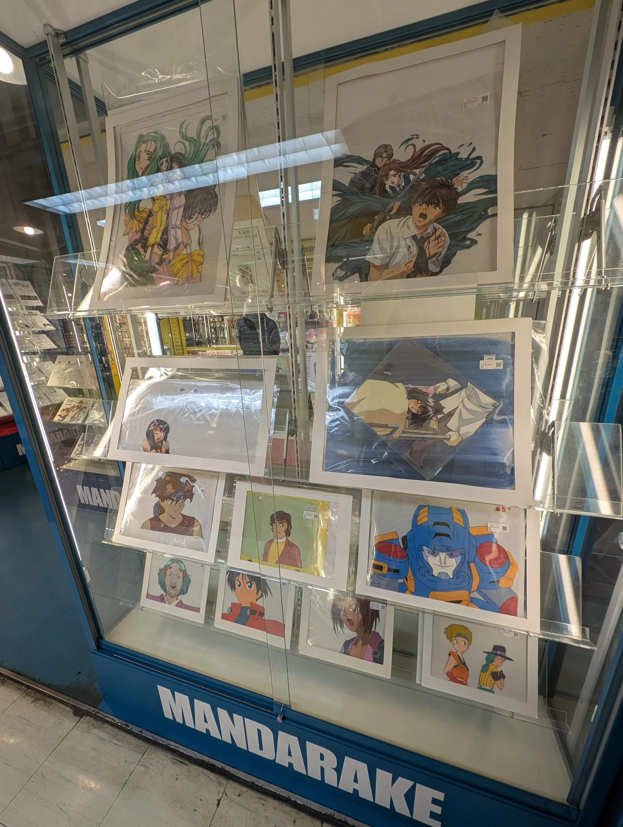 Collectibles and hobby products displayed in a Nakano Broadway shop.
