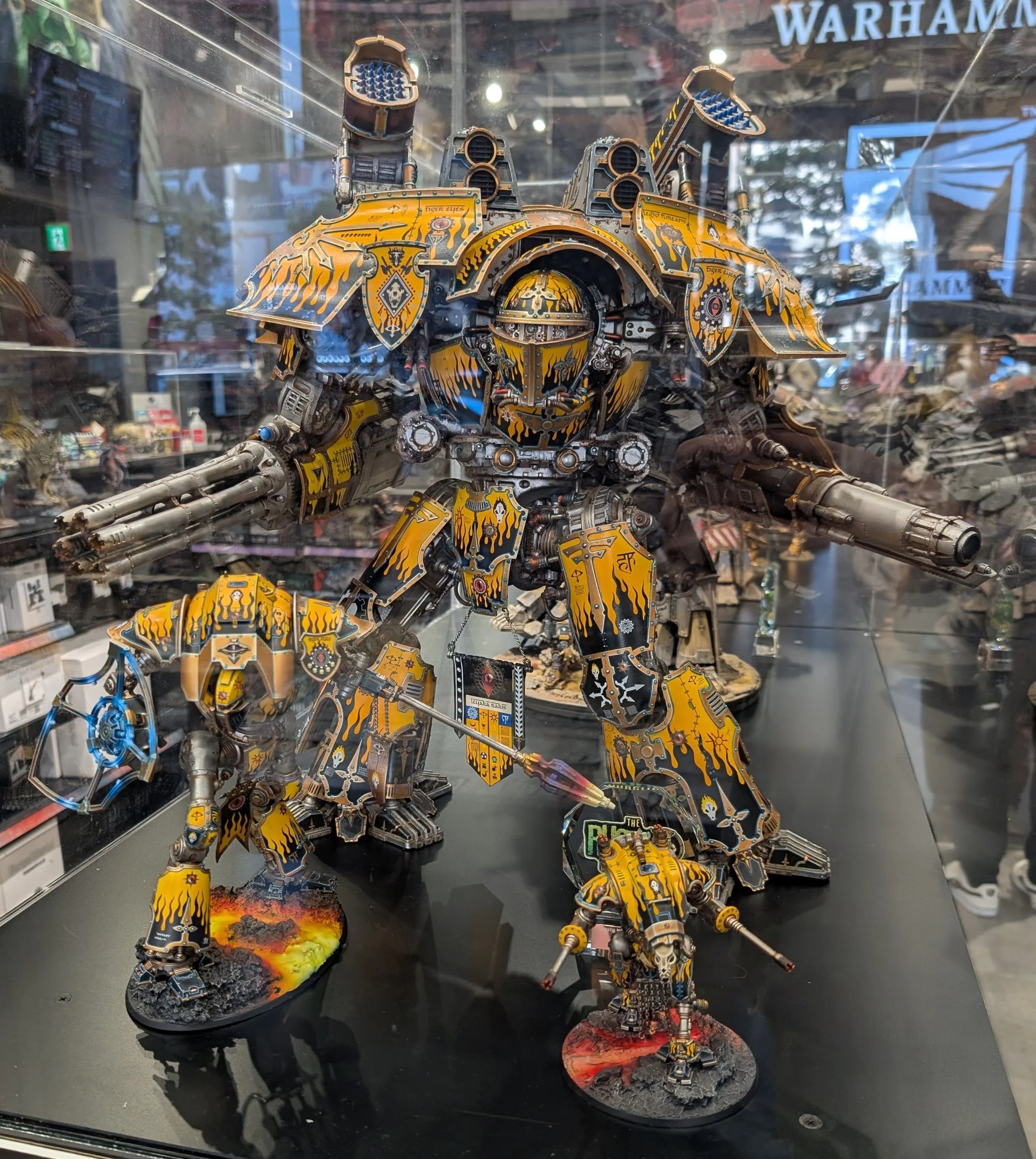 A display case of painted Warhammer miniatures.